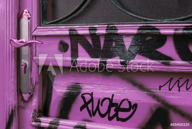 Picture of Purple door detail with black graffity